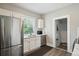 Bright kitchen with stainless steel appliances, a view of the backyard and updated sink at 1456 Syracuse St, Denver, CO 80220
