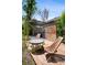Cozy backyard patio with a wooden pergola and privacy screen, creating a private and relaxing space at 1456 Syracuse St, Denver, CO 80220