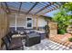 Inviting patio area featuring comfortable seating under a pergola, perfect for outdoor entertainment at 1456 Syracuse St, Denver, CO 80220