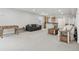 Spacious finished basement with open floorplan, carpet floors, and multiple couches at 6553 S Sedalia St, Aurora, CO 80016