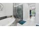 Bright bathroom with a soaking tub, glass shower, and access to the main bedroom at 6553 S Sedalia St, Aurora, CO 80016