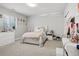 Bright bedroom featuring neutral walls, a white bed frame and matching dresser at 6553 S Sedalia St, Aurora, CO 80016