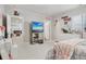 Cozy bedroom with a television, carpeted floors, and a well-lit interior at 6553 S Sedalia St, Aurora, CO 80016