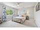 Cozy bedroom with a ceiling fan, a large window, and a calming color scheme at 6553 S Sedalia St, Aurora, CO 80016