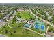 Aerial shot features a community park with walking trails, tennis courts, and playground at 6553 S Sedalia St, Aurora, CO 80016