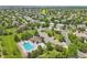 Overhead shot of a community pool with lounge chairs, a pool house, and green trees at 6553 S Sedalia St, Aurora, CO 80016