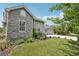 A house with a stone exterior and manicured lawn is displayed in the landscape at 6553 S Sedalia St, Aurora, CO 80016