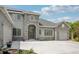 A stunning home with a stone facade, a wide driveway, and meticulously landscaped front yard at 6553 S Sedalia St, Aurora, CO 80016