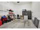 Spacious garage with ample storage space and a concrete floor ready for vehicles at 6553 S Sedalia St, Aurora, CO 80016
