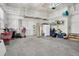 Well-organized garage with overhead storage and ample space for tools and equipment at 6553 S Sedalia St, Aurora, CO 80016