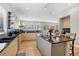 Modern kitchen with stainless steel appliances, sleek countertops, and ample cabinet space for storage at 6553 S Sedalia St, Aurora, CO 80016