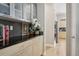 Bright kitchen pantry area with ample storage space, black counters, and stylish backsplash at 6553 S Sedalia St, Aurora, CO 80016