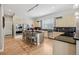 Stylish kitchen featuring stainless steel appliances, dark countertops, and sleek light wood cabinetry at 6553 S Sedalia St, Aurora, CO 80016