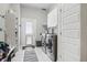 Well-equipped laundry room featuring modern washer and dryer with lots of storage space at 6553 S Sedalia St, Aurora, CO 80016