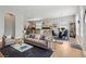 Spacious living room with a view of the kitchen and dining area, perfect for entertaining guests at 6553 S Sedalia St, Aurora, CO 80016