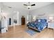 Bright and airy main bedroom featuring hardwood floors and ensuite bathroom at 6553 S Sedalia St, Aurora, CO 80016