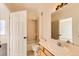 Clean bathroom featuring a vanity, mirror with Hollywood lights, and a shower-tub combination at 8481 W Union Ave # 2-204, Littleton, CO 80123