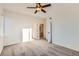 Bright, carpeted bedroom with neutral walls, ceiling fan, and ensuite bathroom access at 8481 W Union Ave # 2-204, Littleton, CO 80123