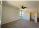 Spacious bedroom features neutral carpet, ceiling fan, natural light, and ensuite bathroom access at 8481 W Union Ave # 2-204, Littleton, CO 80123