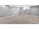 Spacious finished basement with carpet flooring and ample natural light at 5725 W Mississippi Ave, Lakewood, CO 80226