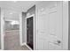 View of the basement area with a large carpeted area and a secure vault door at 5725 W Mississippi Ave, Lakewood, CO 80226