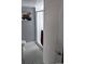 Clean bathroom featuring a tiled shower, patterned flooring, and neutral color scheme at 5725 W Mississippi Ave, Lakewood, CO 80226