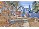 Charming blue home with sidewalk, mature trees, and landscaped yard at 5725 W Mississippi Ave, Lakewood, CO 80226