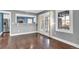 Living room featuring French doors to backyard and views into kitchen at 5725 W Mississippi Ave, Lakewood, CO 80226