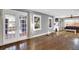 Open-concept living room with hardwood floors, a fireplace, and lots of natural light at 5725 W Mississippi Ave, Lakewood, CO 80226