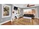 Inviting living room featuring a unique fireplace, hardwood floors, and large windows at 5725 W Mississippi Ave, Lakewood, CO 80226