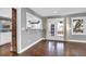 Living room featuring views into kitchen and French doors to backyard at 5725 W Mississippi Ave, Lakewood, CO 80226