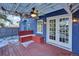 Charming outdoor patio featuring a built-in bench and double doors at 5725 W Mississippi Ave, Lakewood, CO 80226