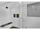 Modern shower with a glass door, rainfall showerhead, and tiled walls at 5725 W Mississippi Ave, Lakewood, CO 80226