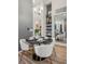 Elegant dining room with modern lighting, stylish decor, and seating for four at 487 Interlocken Blvd # 104, Broomfield, CO 80021