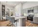 Well-appointed kitchen with stainless steel appliances, granite countertops, and a functional island at 487 Interlocken Blvd # 104, Broomfield, CO 80021