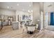 Open-concept living area with a stylish kitchen, dining space, and comfortable seating area at 487 Interlocken Blvd # 104, Broomfield, CO 80021