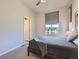 Inviting bedroom with modern accents and a sun-lit view of the neighborhood at 10071 Belvedere Cir, Lone Tree, CO 80124