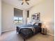 Well-lit bedroom with a comfortable bed, side tables, and modern window coverings at 10071 Belvedere Cir, Lone Tree, CO 80124