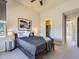 Spacious bedroom featuring neutral tones, a comfortable bed, and ample natural light at 10071 Belvedere Cir, Lone Tree, CO 80124