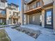 Modern townhome with private patio and well-maintained landscaping providing an inviting outdoor space at 10071 Belvedere Cir, Lone Tree, CO 80124