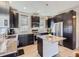 Modern kitchen boasting granite countertops, stainless steel appliances, and dark cabinets, creating an elegant space at 10071 Belvedere Cir, Lone Tree, CO 80124