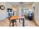Inviting living space featuring a dining area, comfortable seating, and abundant natural light from large windows at 10071 Belvedere Cir, Lone Tree, CO 80124
