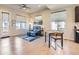 Open-concept living area with modern decor, dining table, and hardwood floors at 10071 Belvedere Cir, Lone Tree, CO 80124