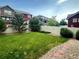Landscaped backyard features a lush lawn, privacy fence and stone pathway at 133 Poppy View Ln, Erie, CO 80516