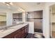 Beautiful bathroom with double sinks, granite countertops, a walk-in shower, and tile flooring at 133 Poppy View Ln, Erie, CO 80516
