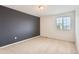 A bright bedroom features a neutral wall and a large window, filling the room with natural light at 133 Poppy View Ln, Erie, CO 80516