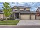 Attractive two story home featuring manicured front yard and three car attached garage at 133 Poppy View Ln, Erie, CO 80516