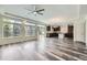 Bright living room with access to a modern kitchen featuring an island, perfect for entertaining at 133 Poppy View Ln, Erie, CO 80516