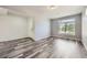Bright and simple living room featuring hardwood floors and natural light at 133 Poppy View Ln, Erie, CO 80516