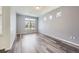 Bright living room featuring hardwood floors and natural light at 133 Poppy View Ln, Erie, CO 80516